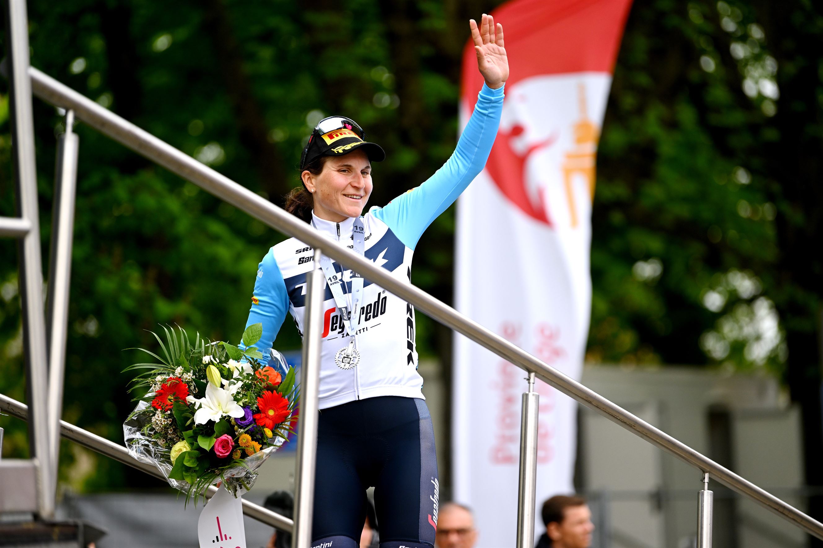 Elisa Longo Borghini walking onto the podium at Liege 2023, where she finished second